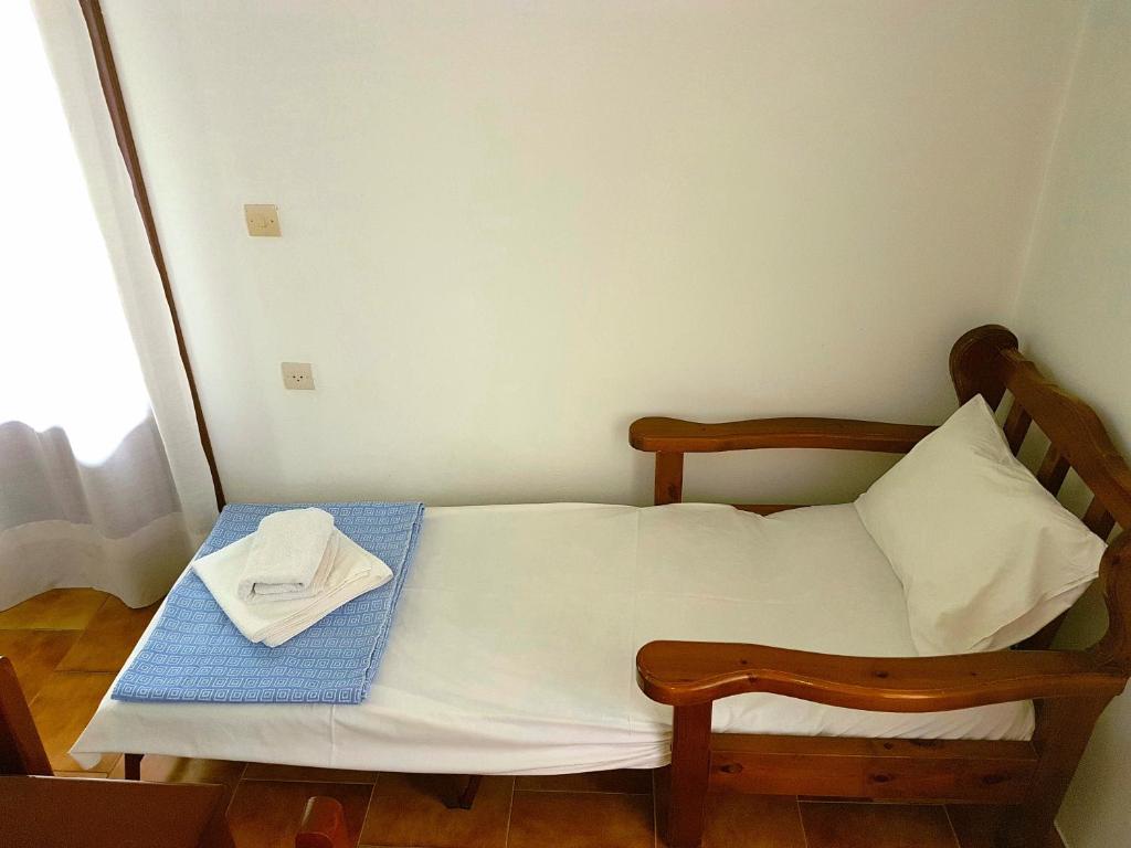 A bed or beds in a room at Alexandros Studios