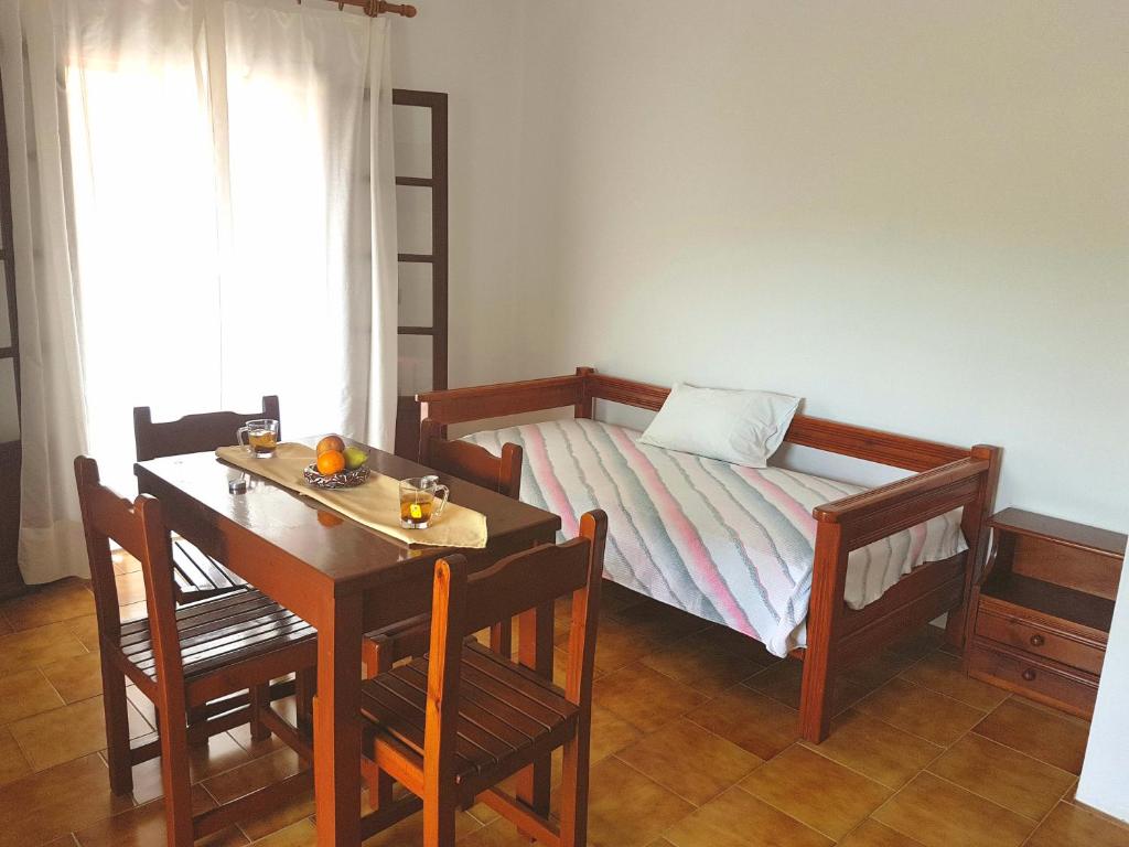 A bed or beds in a room at Alexandros Studios