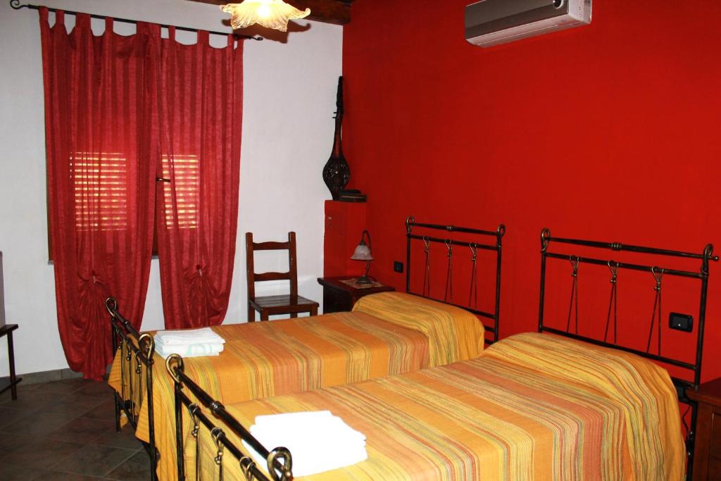 Posteľ alebo postele v izbe v ubytovaní B&B funtanadetalia