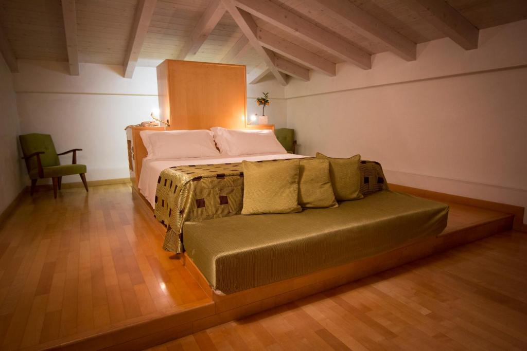 Łóżko lub łóżka w pokoju w obiekcie Hotel Terranobile Metaresort
