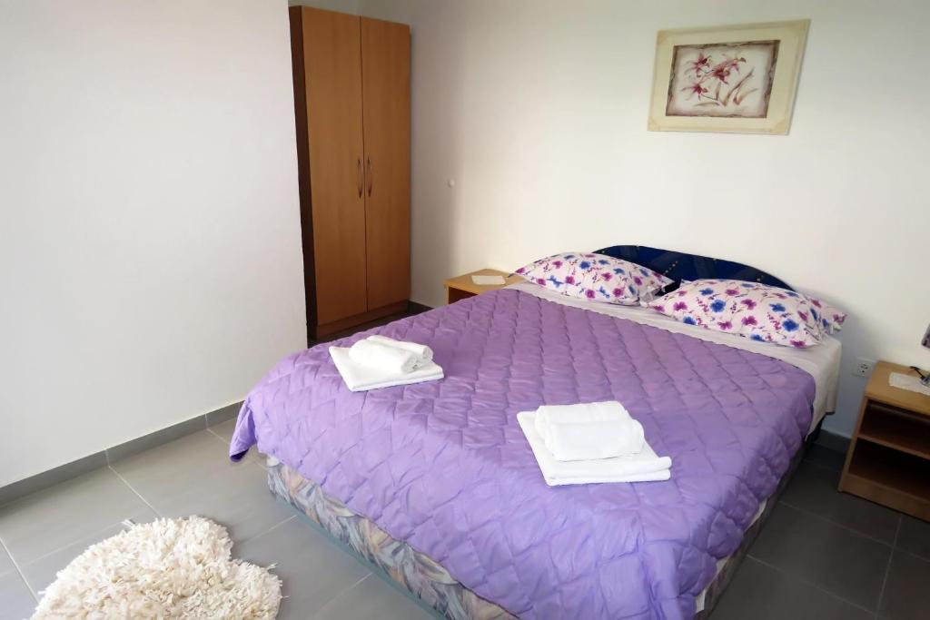 Posteľ alebo postele v izbe v ubytovaní Apartments Milena & Ante