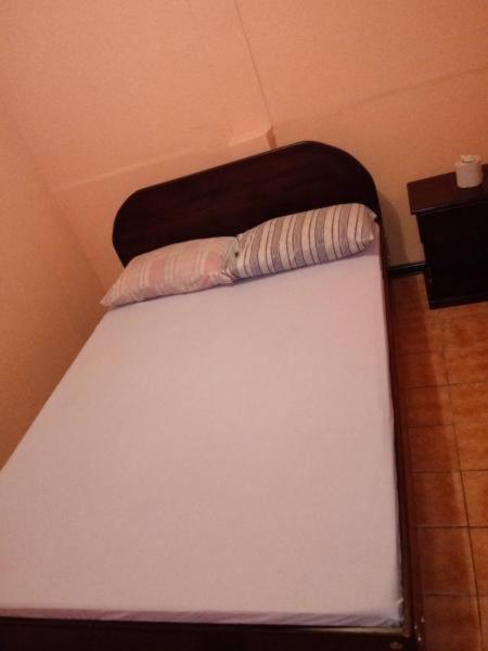 Postel nebo postele na pokoji v ubytování Hotel Latino