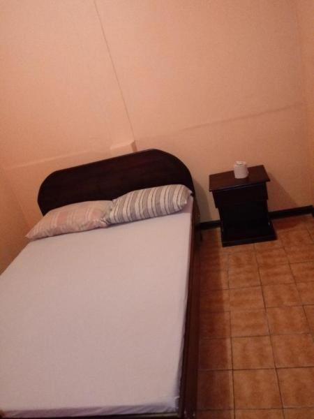 Postel nebo postele na pokoji v ubytování Hotel Latino