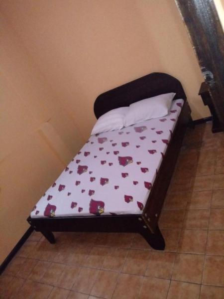 Postel nebo postele na pokoji v ubytování Hotel Latino