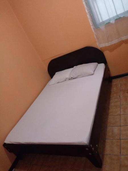 Postel nebo postele na pokoji v ubytování Hotel Latino