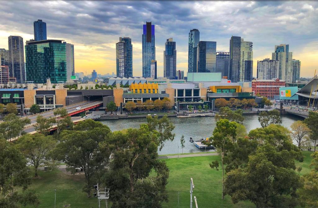 a view of a city with a river and buildings at Melbourne River Views in Melbourne