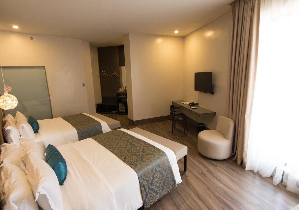TV a/nebo společenská místnost v ubytování Goldberry Lite Hotel