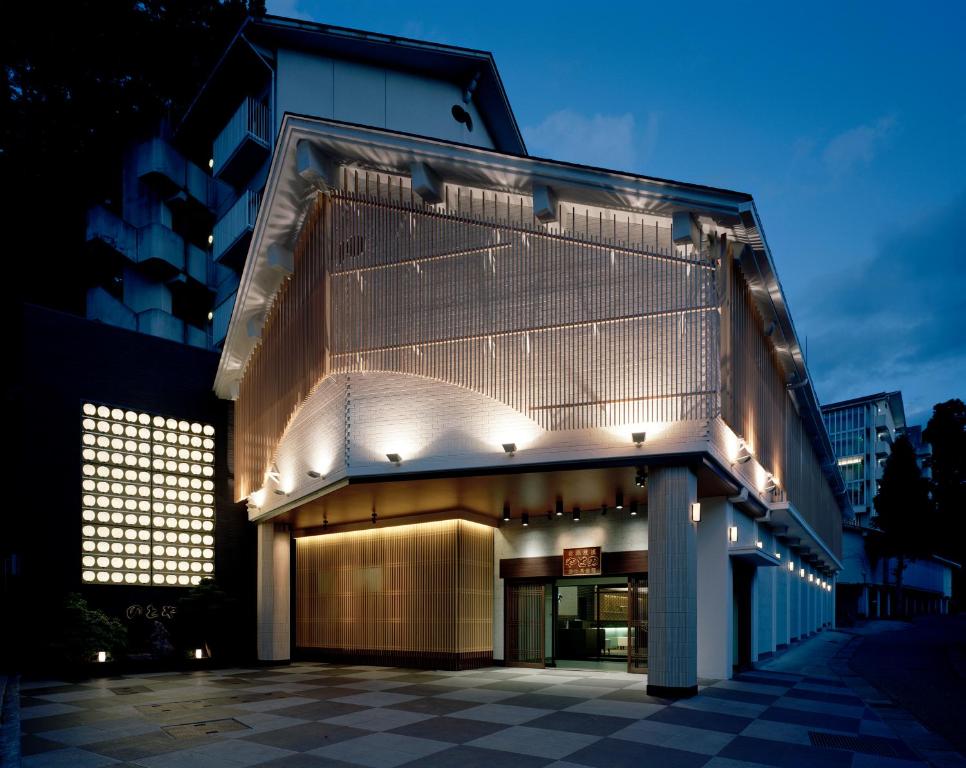 a large building with lights on the side of it at Notoya in Komatsu
