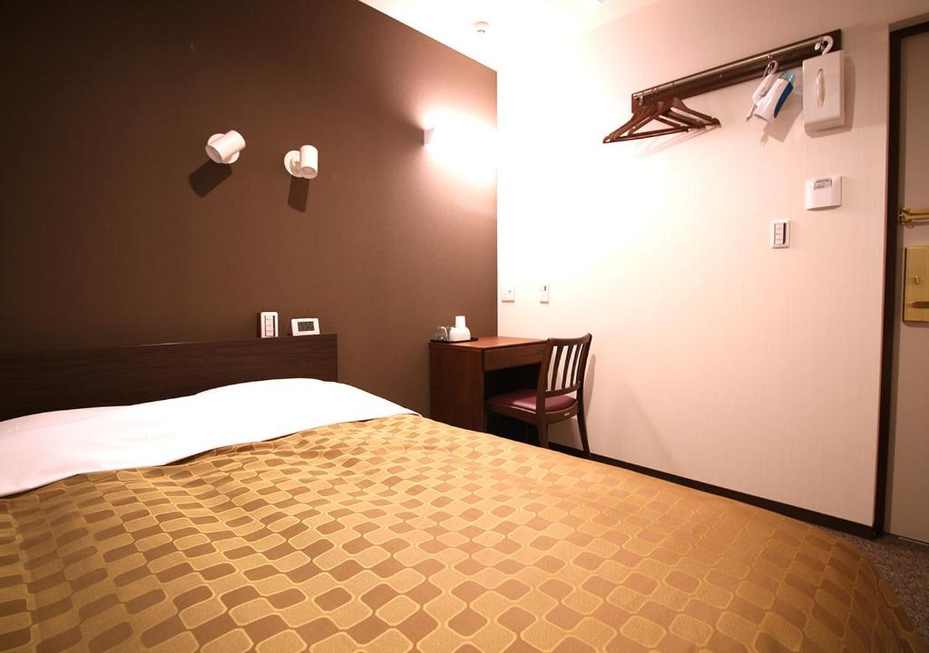 Postel nebo postele na pokoji v ubytování Hotel Trend Asakusa Annex