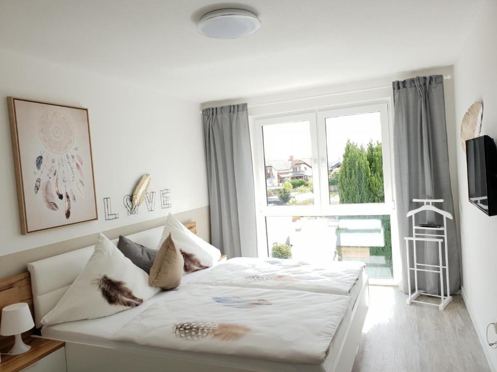 Postel nebo postele na pokoji v ubytování Ferienwohnung "Saartal"