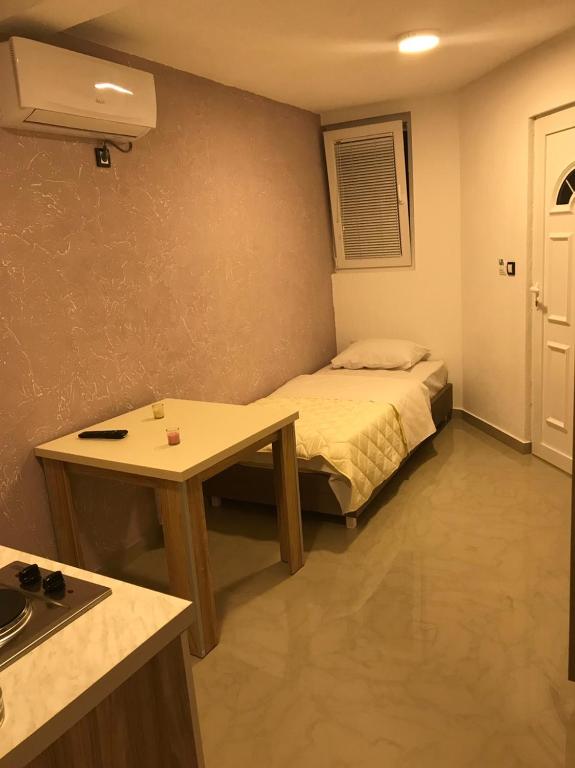 Postel nebo postele na pokoji v ubytování Vip Apartmani Canj