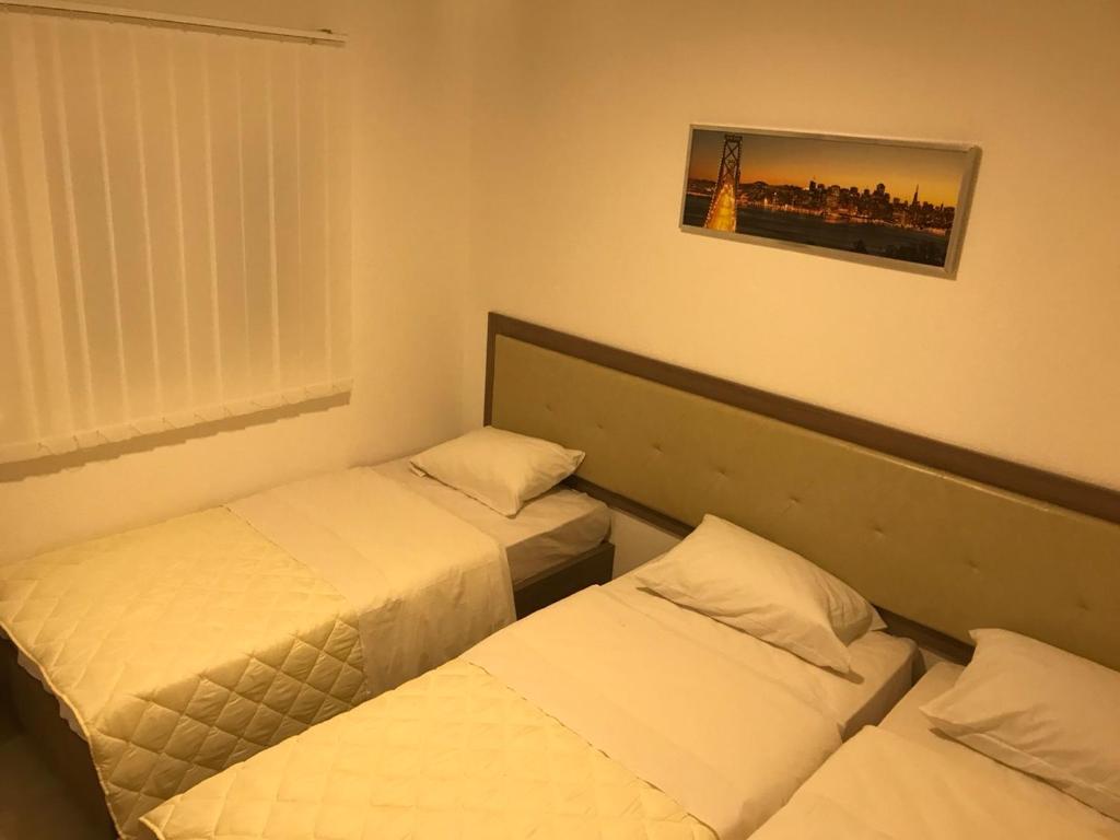 Postel nebo postele na pokoji v ubytování Vip Apartmani Canj