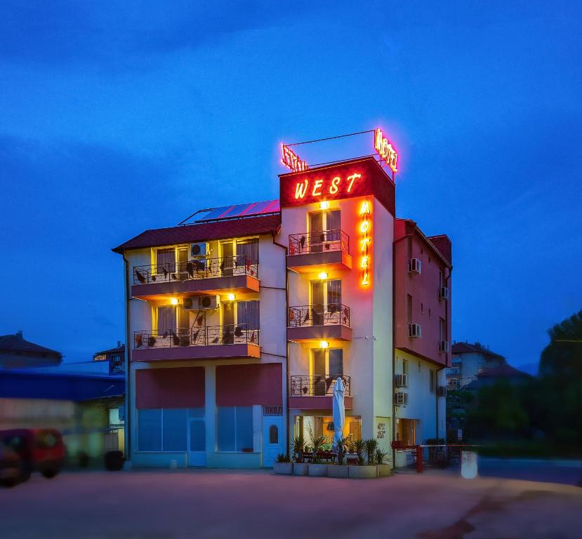 a hotel with a sign that reads userk at Hotel West in Blagoevgrad