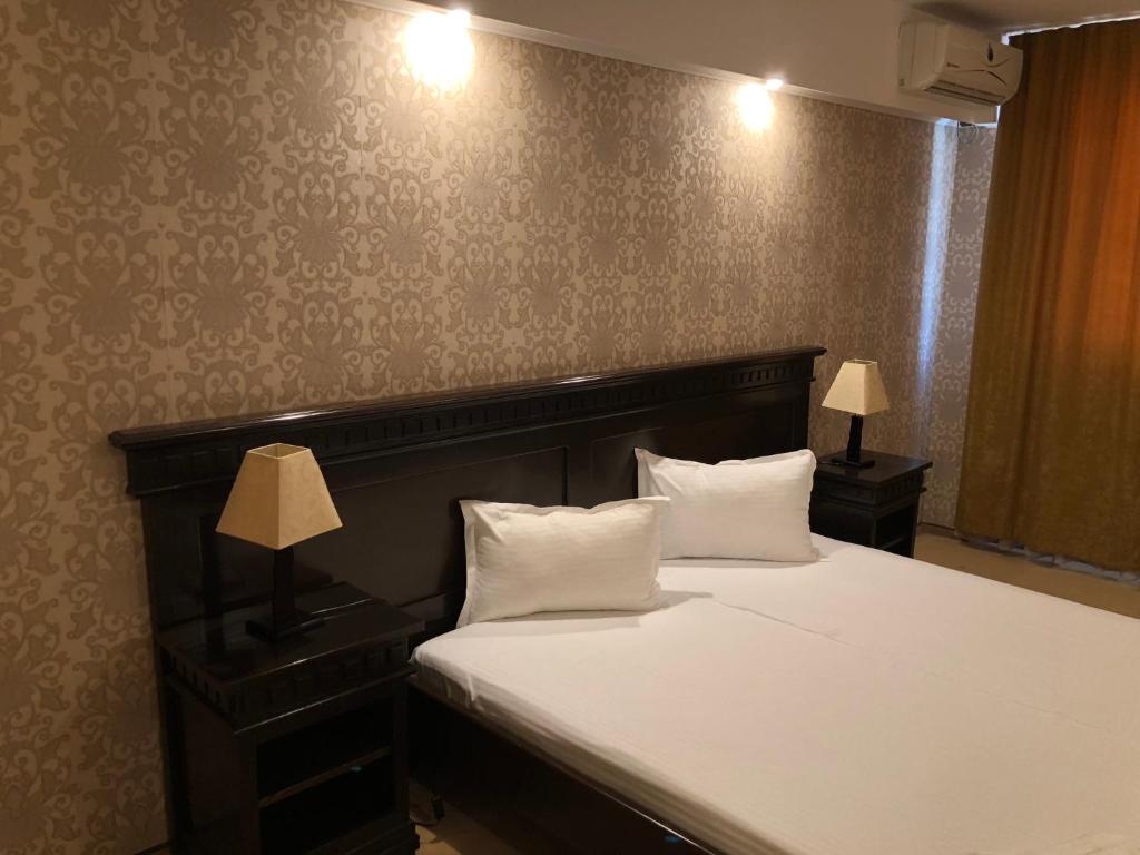 Posteľ alebo postele v izbe v ubytovaní Hotel Condor