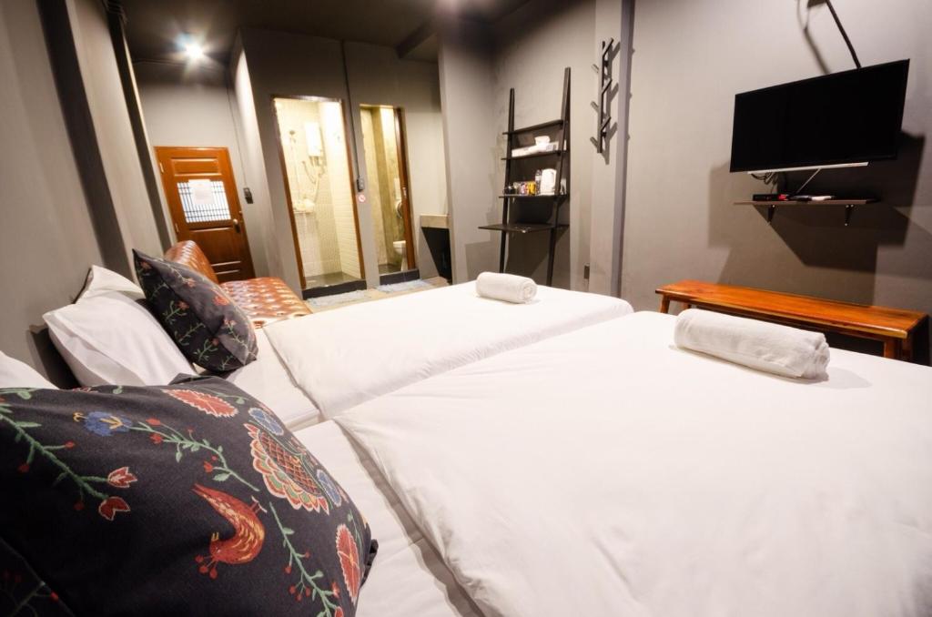 Giường trong phòng chung tại Tian Tian Hostel