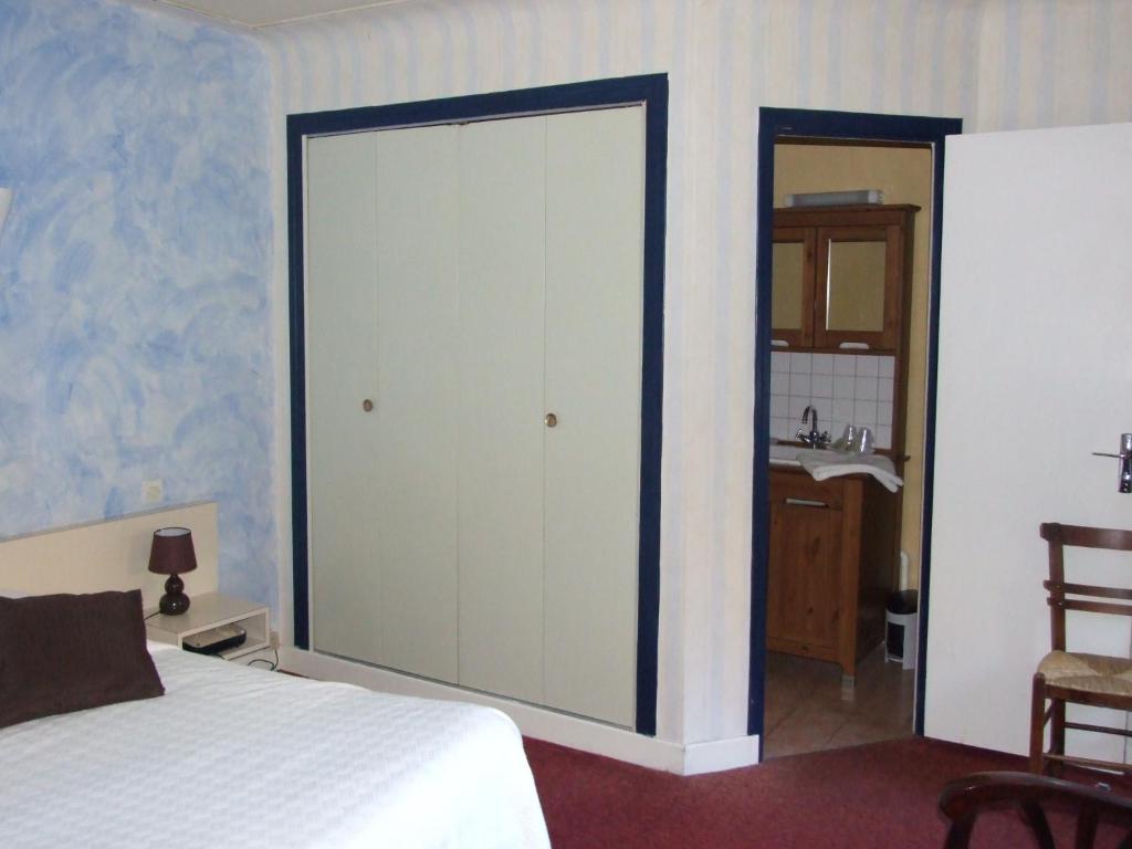 Voodi või voodid majutusasutuse Hôtel du Val d'Aure toas