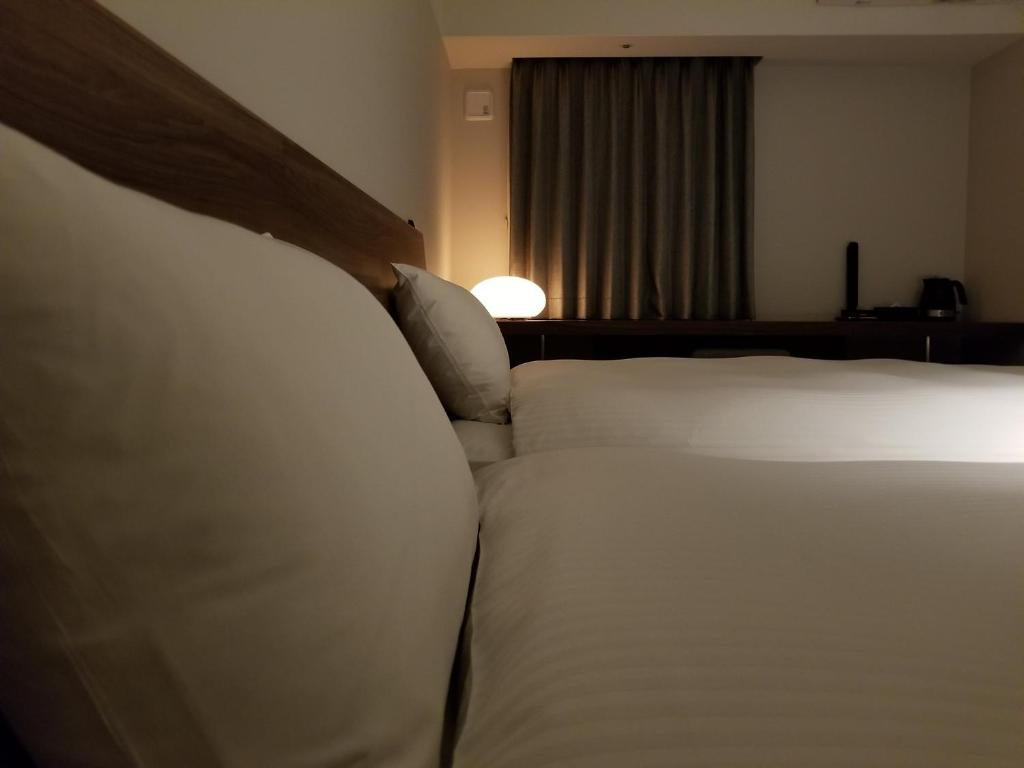 Postel nebo postele na pokoji v ubytování BRENZA HOTEL