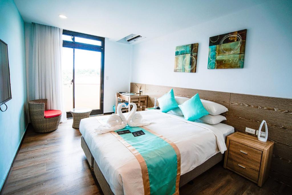 Postel nebo postele na pokoji v ubytování Palau Hotel