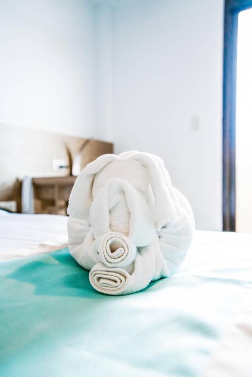 Postel nebo postele na pokoji v ubytování Palau Hotel