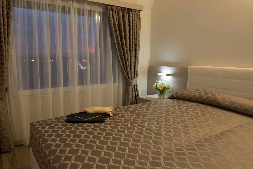 Postel nebo postele na pokoji v ubytování Expo Hotel Milan