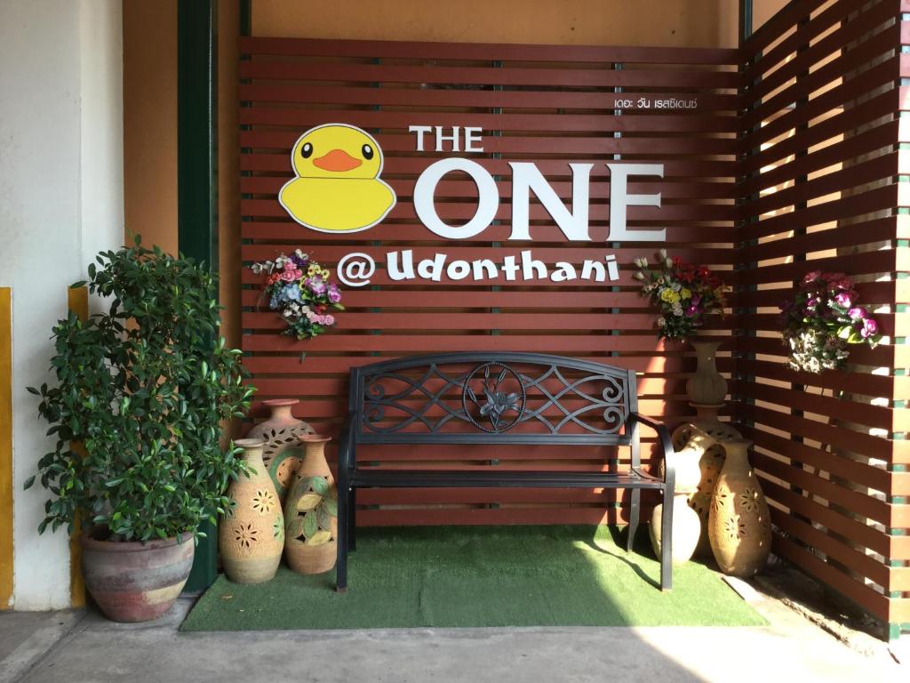 a sign that says the one quarantine next to a bench at The One Residence in Udon Thani