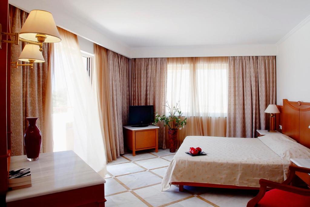 Postel nebo postele na pokoji v ubytování Pilot Beach Resort