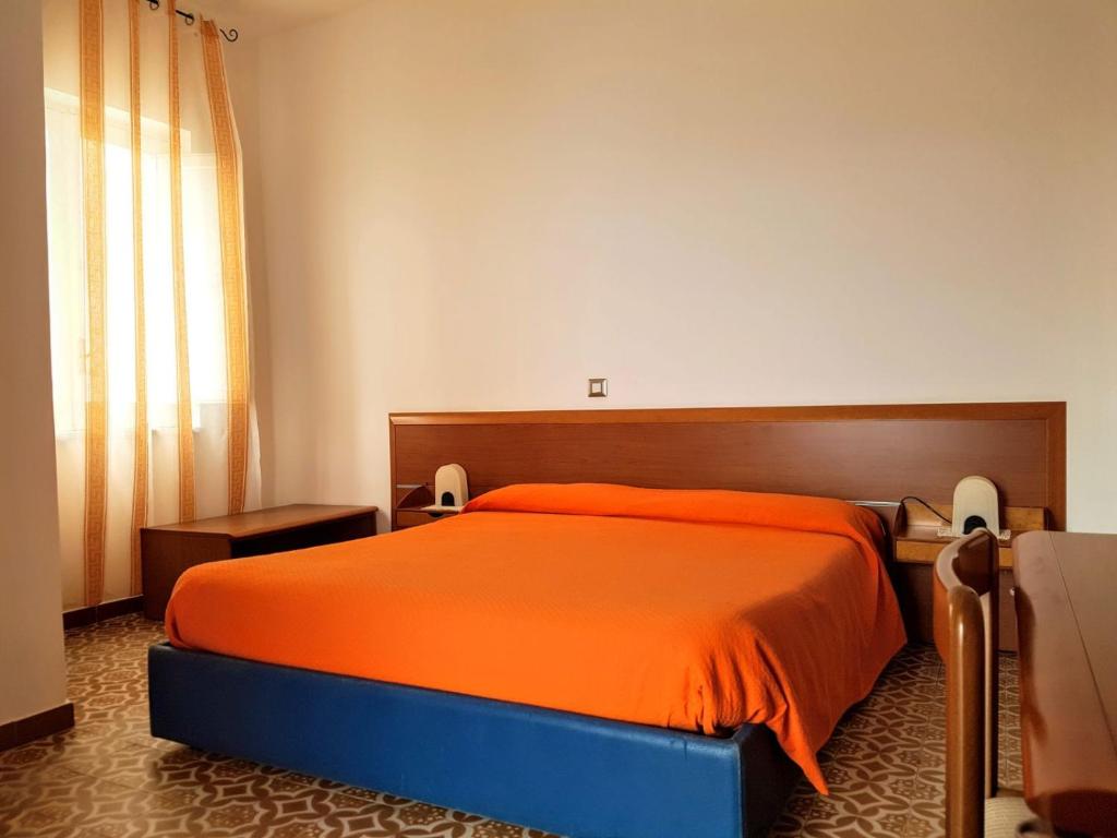 Postel nebo postele na pokoji v ubytování Albergo Villa Verde
