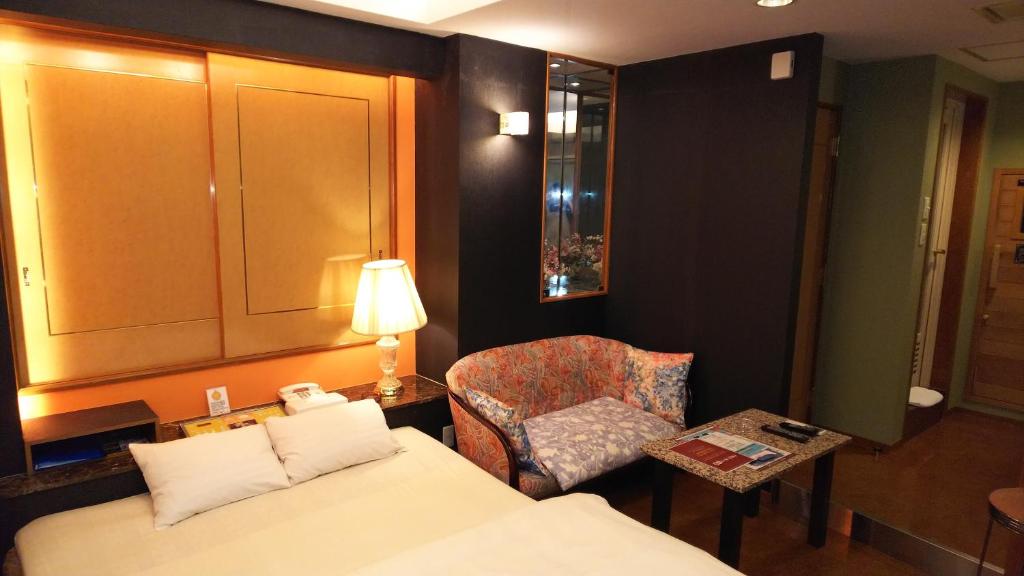 Postel nebo postele na pokoji v ubytování Hotel Essor (Adult Only)
