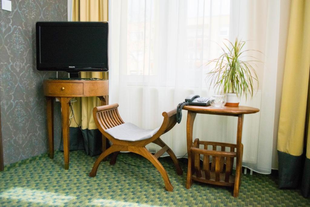 TV a/nebo společenská místnost v ubytování Petra Hotel