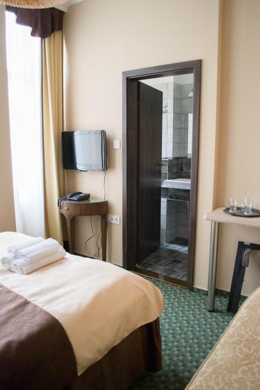 Postel nebo postele na pokoji v ubytování Petra Hotel
