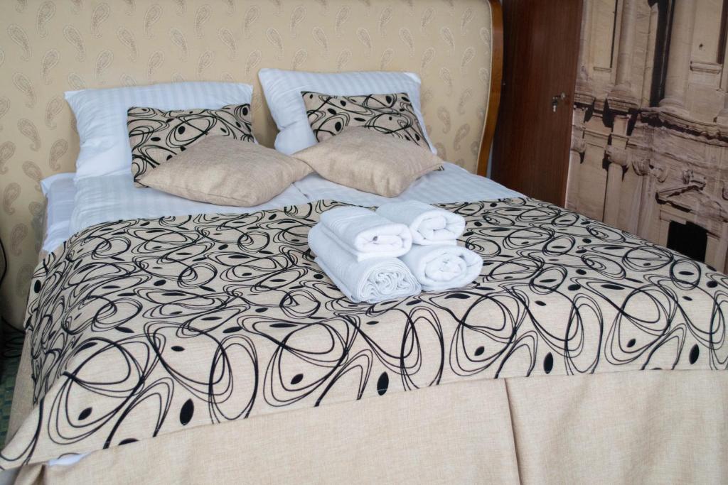 Postel nebo postele na pokoji v ubytování Petra Hotel