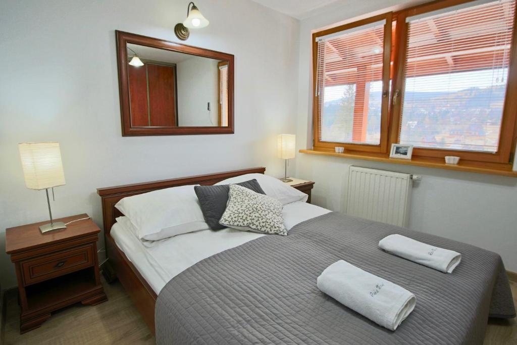 Posteľ alebo postele v izbe v ubytovaní Apartament BazaTatry Giewont View