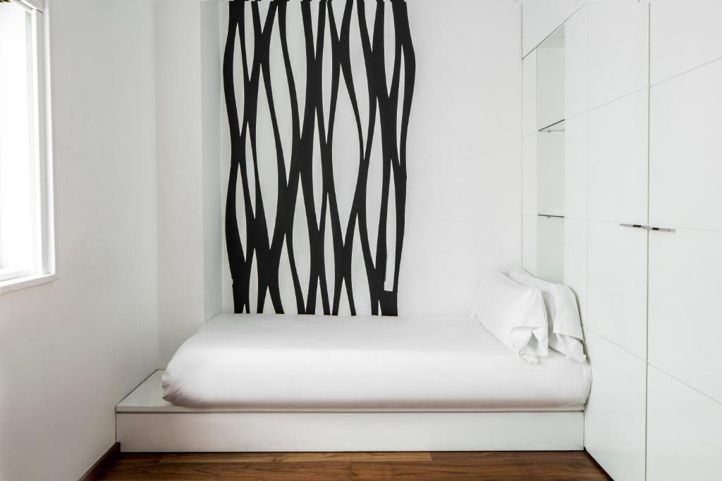 Postel nebo postele na pokoji v ubytování Suites Avenue