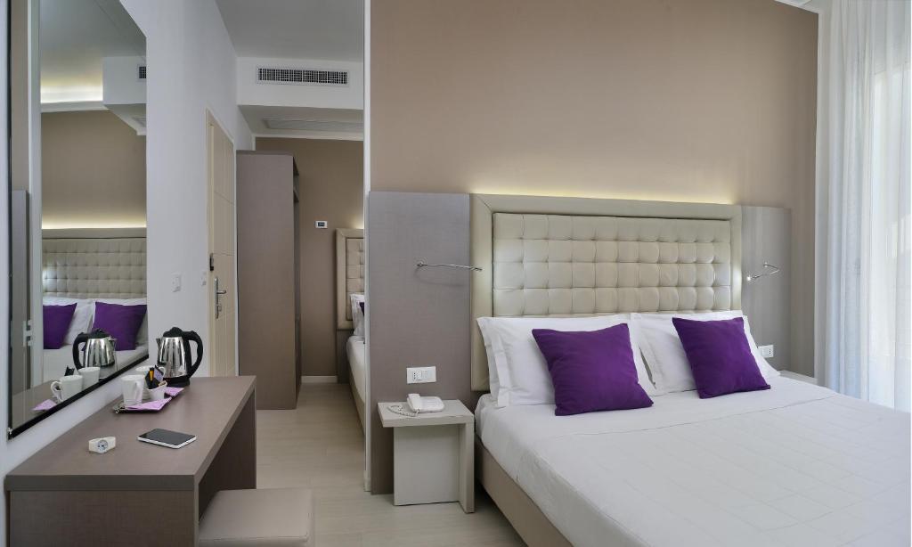 Postel nebo postele na pokoji v ubytování Hotel Boemia