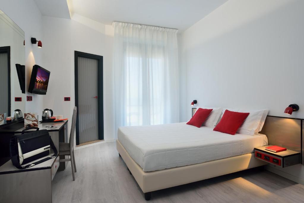 Postel nebo postele na pokoji v ubytování Hotel Boemia