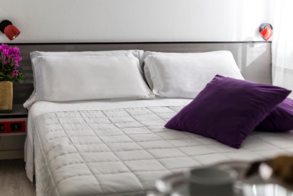 Postel nebo postele na pokoji v ubytování Hotel Boemia