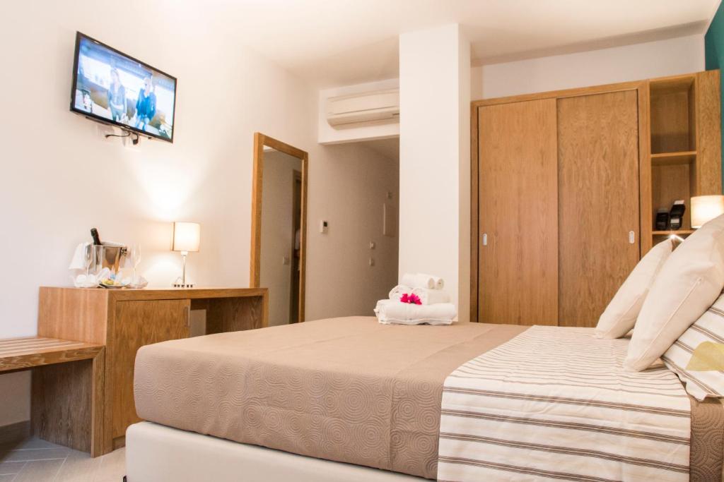Postel nebo postele na pokoji v ubytování Hotel Maria