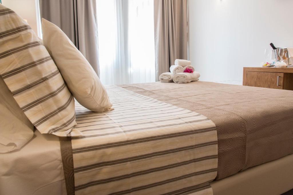 Postel nebo postele na pokoji v ubytování Hotel Maria