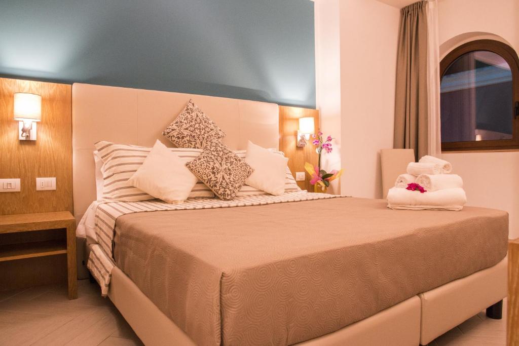 Postel nebo postele na pokoji v ubytování Hotel Maria