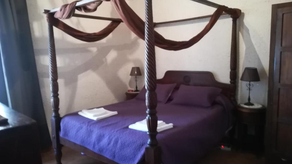 Posteľ alebo postele v izbe v ubytovaní Hostal Restaurante La Diligencia