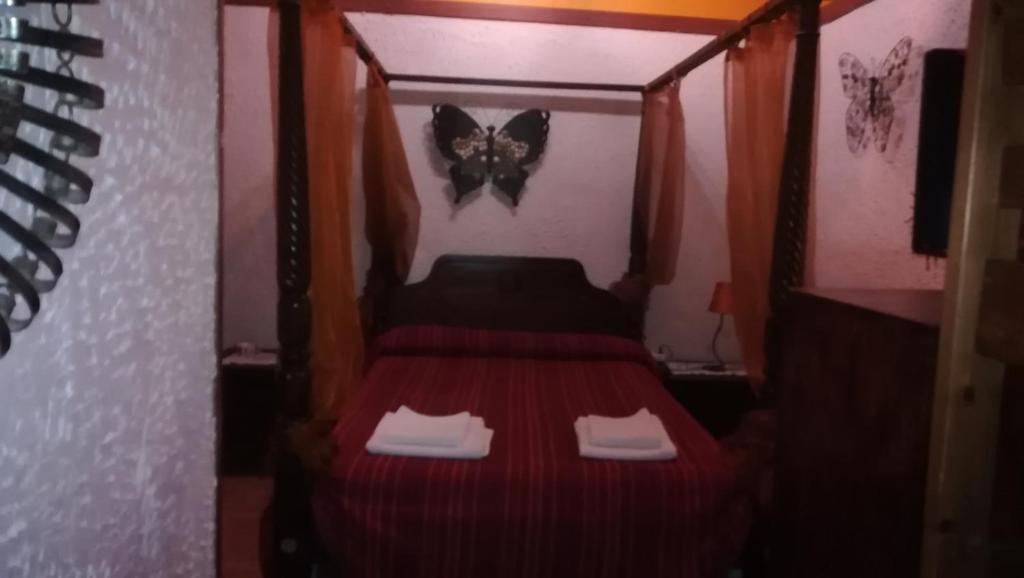 Posteľ alebo postele v izbe v ubytovaní Hostal Restaurante La Diligencia