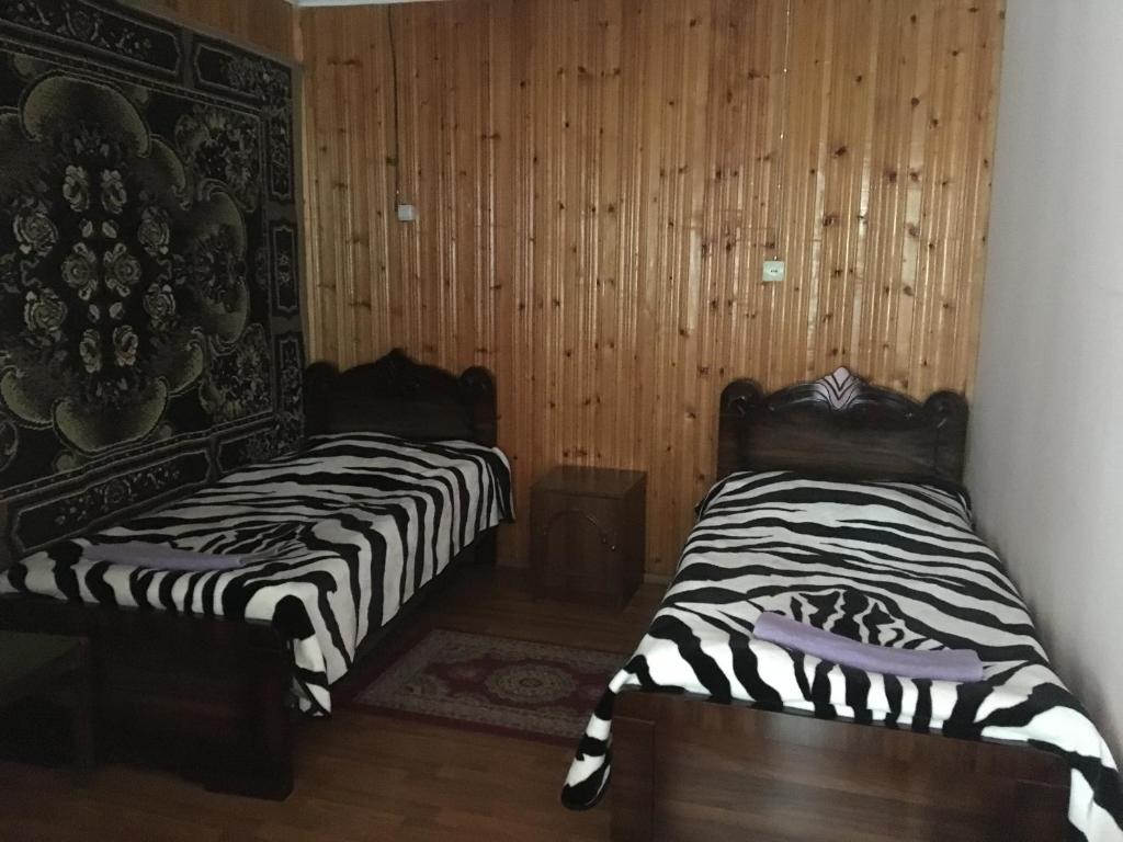 Postel nebo postele na pokoji v ubytování Guest House Nana in Mestia
