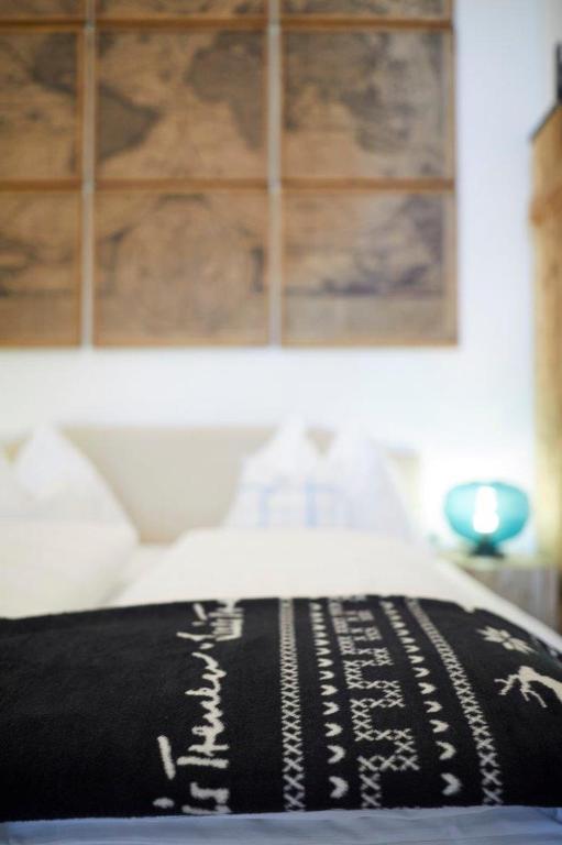 Postel nebo postele na pokoji v ubytování Boutique Appartments AlteGreißlerei