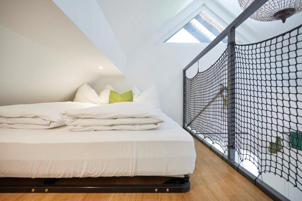 Postel nebo postele na pokoji v ubytování Boutique Appartments AlteGreißlerei