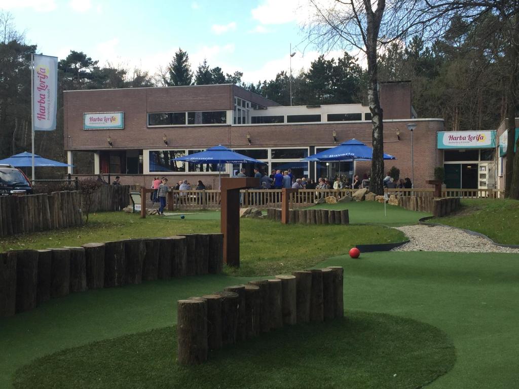 a golf course in front of a building at Harba Lorifa in Valkenswaard