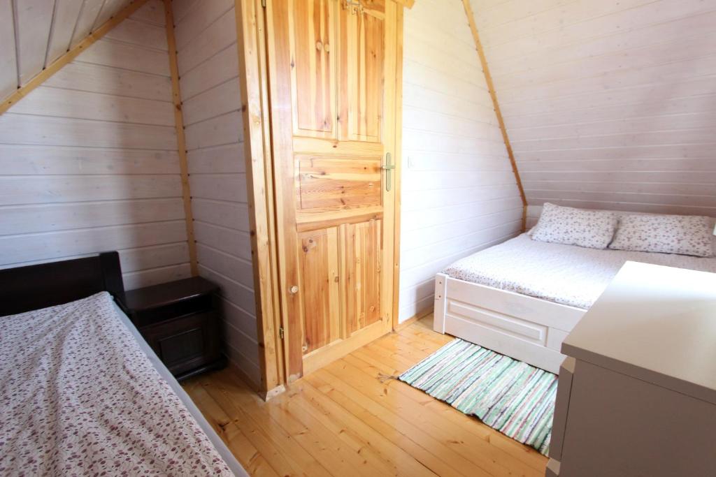 Postel nebo postele na pokoji v ubytování Czerwone Korale