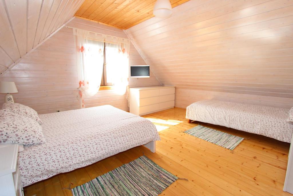 Postel nebo postele na pokoji v ubytování Czerwone Korale