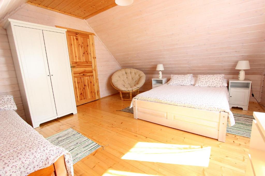 Postel nebo postele na pokoji v ubytování Czerwone Korale