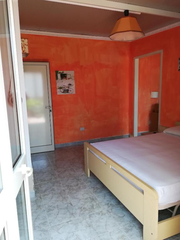 Postel nebo postele na pokoji v ubytování Villa Itaca