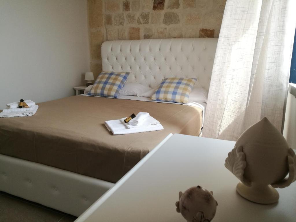 Postel nebo postele na pokoji v ubytování Hotel Residence La Corvetta